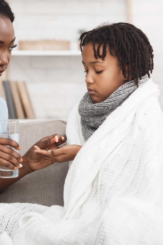 Parent Helping Sick Child