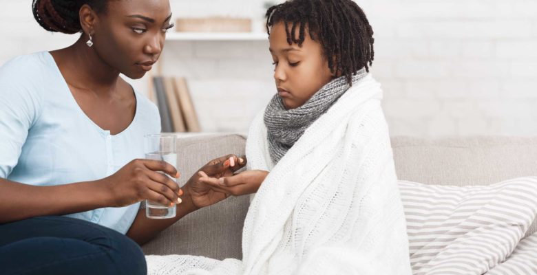 Parent Helping Sick Child