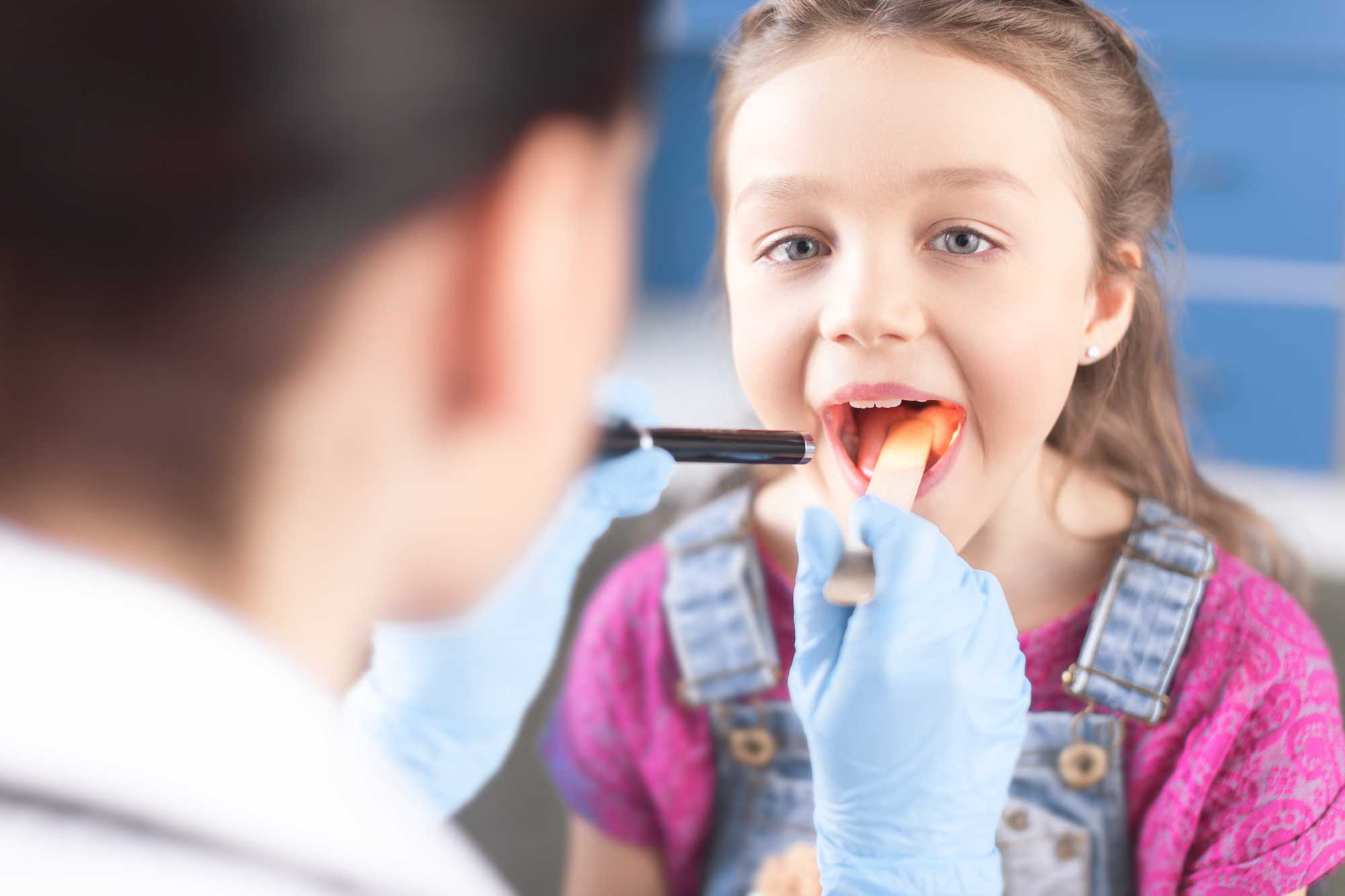 Patient Having Throat Examined